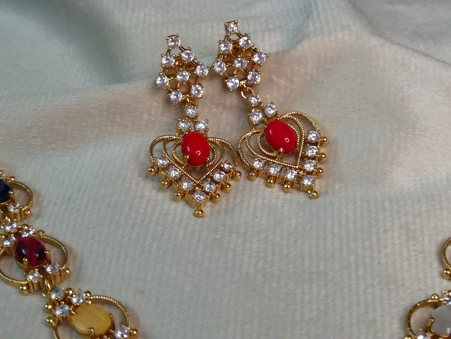 Navratna AD Necklace Set — Antique Gold Multi-Stone Chain with Heart Pendant & Earrings
