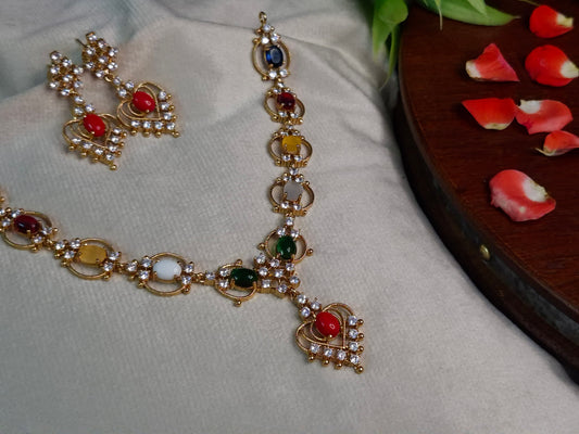 Navratna AD Necklace Set — Antique Gold Multi-Stone Chain with Heart Pendant & Earrings