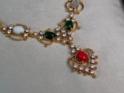 Navratna AD Necklace Set — Antique Gold Multi-Stone Chain with Heart Pendant & Earrings