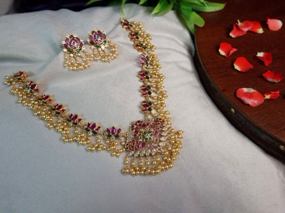 Peacock Guttapusalu Necklace Set — Antique Gold Ruby & Emerald Lotus Chain with Pearl Drops & Stud Earrings
