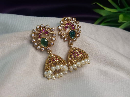Antique Gold Peacock Jhumka Earrings — Emerald & Ruby AD Stone Open Swirl Top with Pearl Drop Jhumka